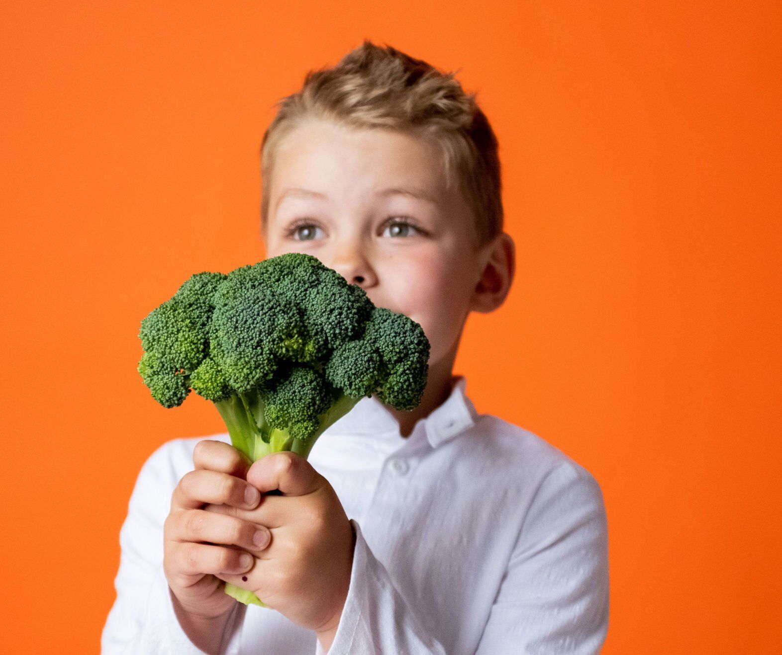 Boy with broccoli